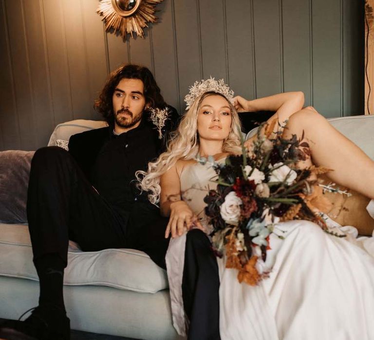 Bride and groom relaxing at Preston Court Halloween wedding