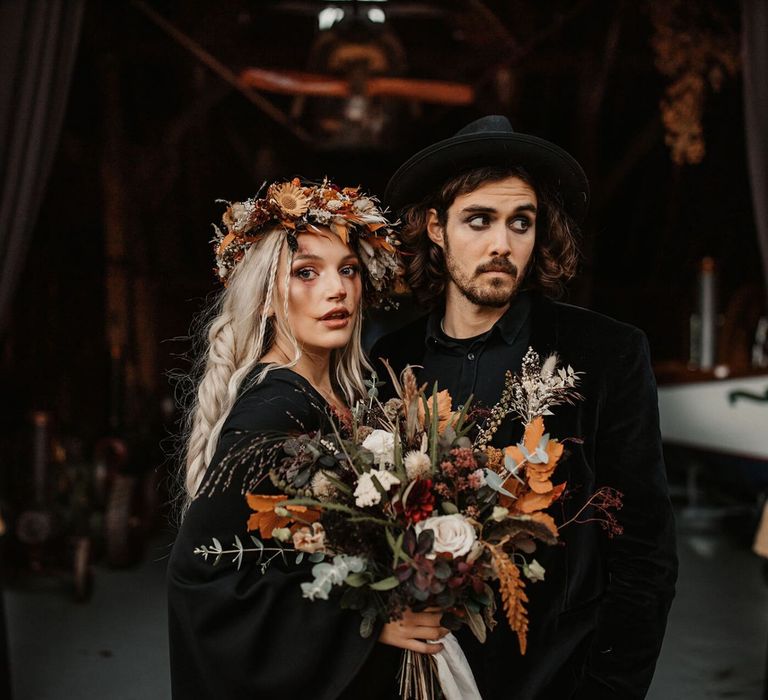 Bride with orange and dried flower bouquet and flower crown at Halloween wedding shoot