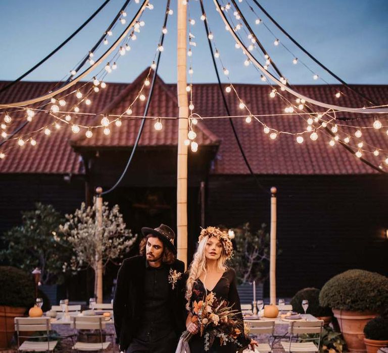 Outdoor seating area at Preston Court with festoon light canopy