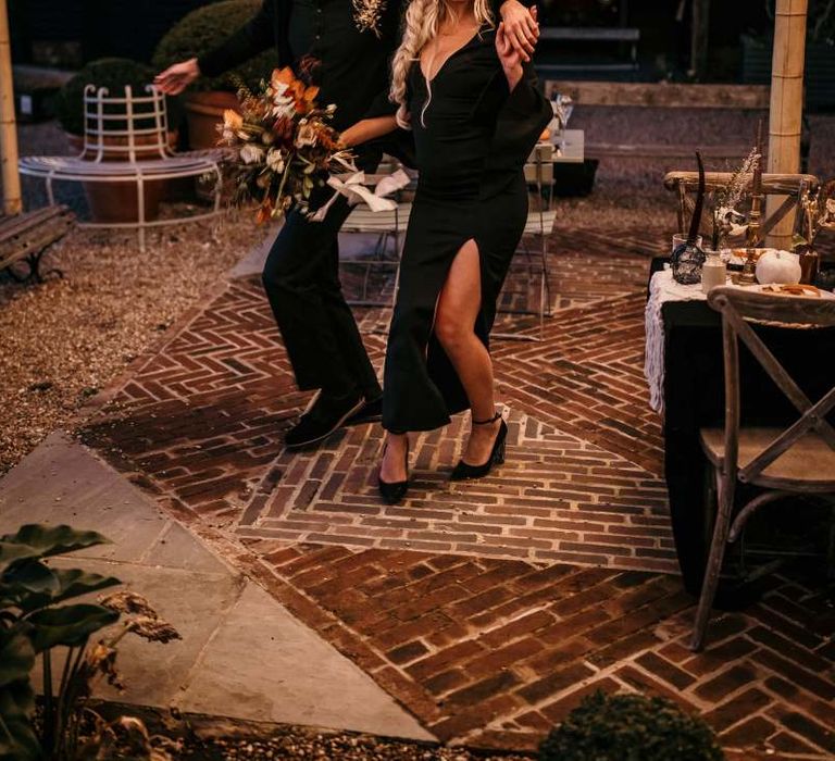 bride and groom dancing outside at Preston Court for Halloween wedding