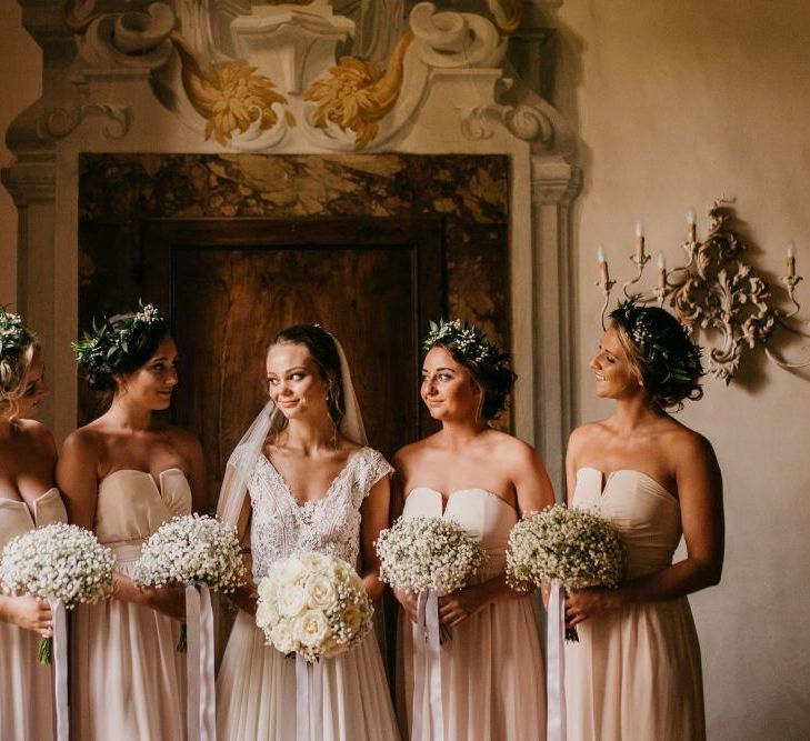 Bridal Party Portrait with Bridesmaids in Pink Dresses Holding Gypsophila Bouquets and Flower Crowns and Bride in Bespoke Wedding Dress