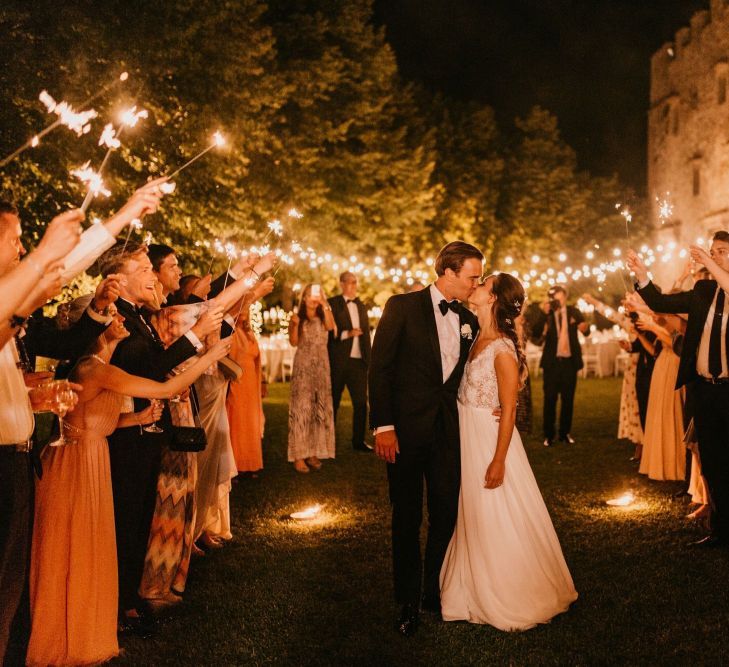 Sparkler Moment with Bride in Bespoke Wedding Dress and Groom in Tuxedo and Bow Tie