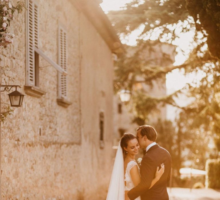 Golden Hour Portrait with Bride in Bespoke Wedding Dress and Groom in Black Tie Suit