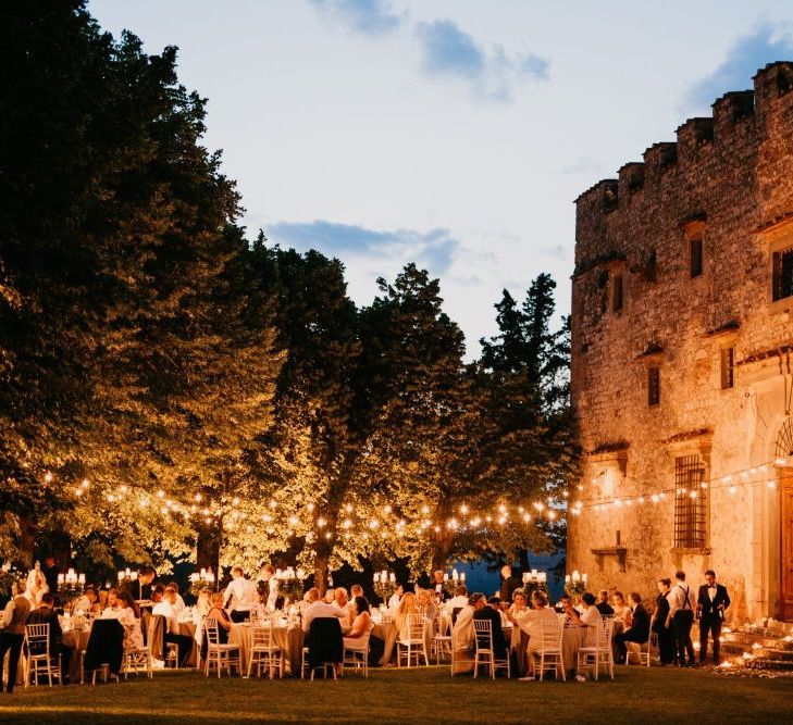 Italian Castle Outdoor Wedding Reception Lit Up with Festoon Lights