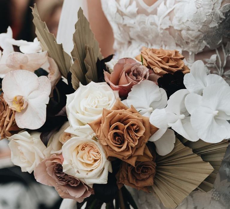 Muted Wedding Bouquet with Dried Palm Leaves, Orchids and Roses