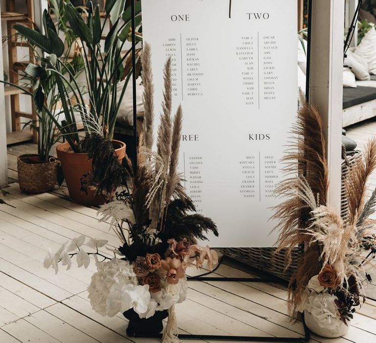 Black Metal Framed Hanging Table Plan with Dried Flower Arrangements