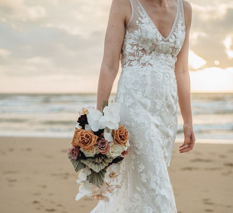 Lace Made with Love Wedding Dress Holding a Muted Flower Wedding Bouquet