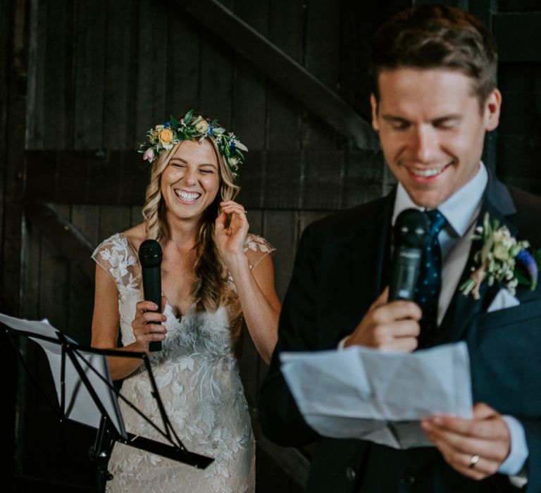 Bride and Groom Laughing During a Joint Wedding Speech