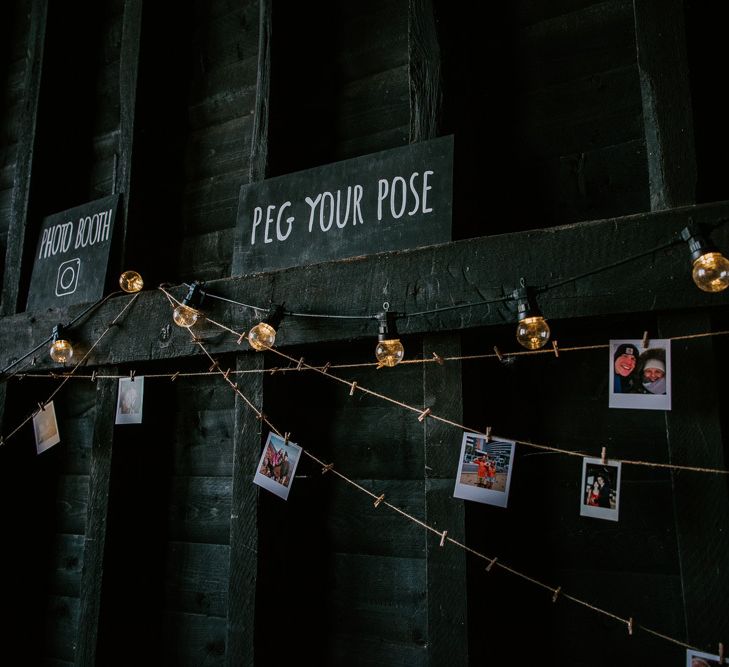 Peg Your Pose Photo Booth Corner with Strung Up Polaroid Pictures