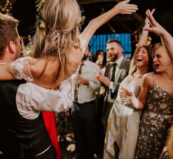 Dance Floor Antics with Groom Picking His Bride Up