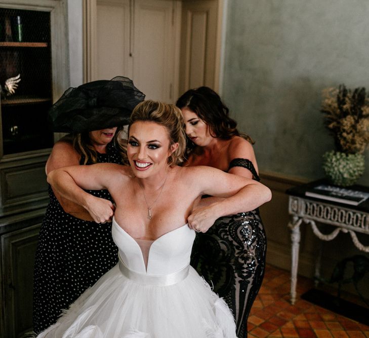 Bride Getting into Her Wedding Dress on the Wedding Morning