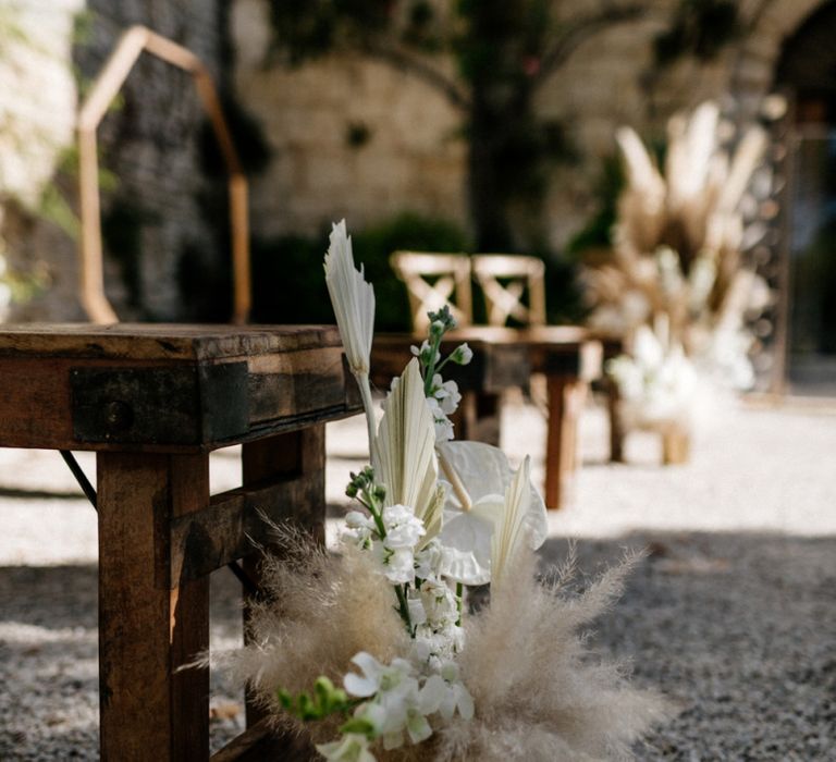 Tropical Aisle Wedding Flowers with Palm Leaves and Orchids