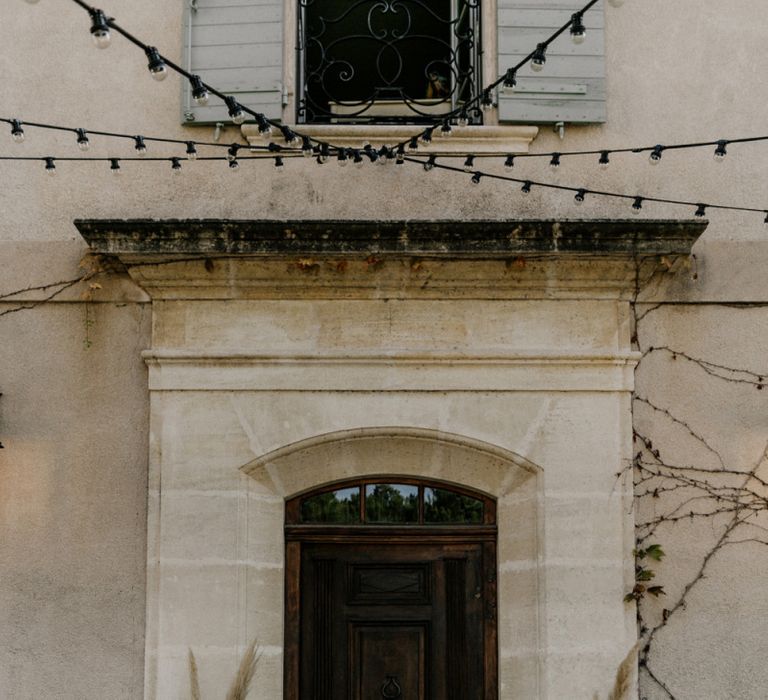 Natural Wedding Venue Flower Arrangements in Gold Pots