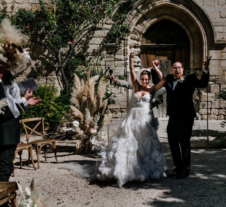 Bride and Groom Celebrating After Being Just Married