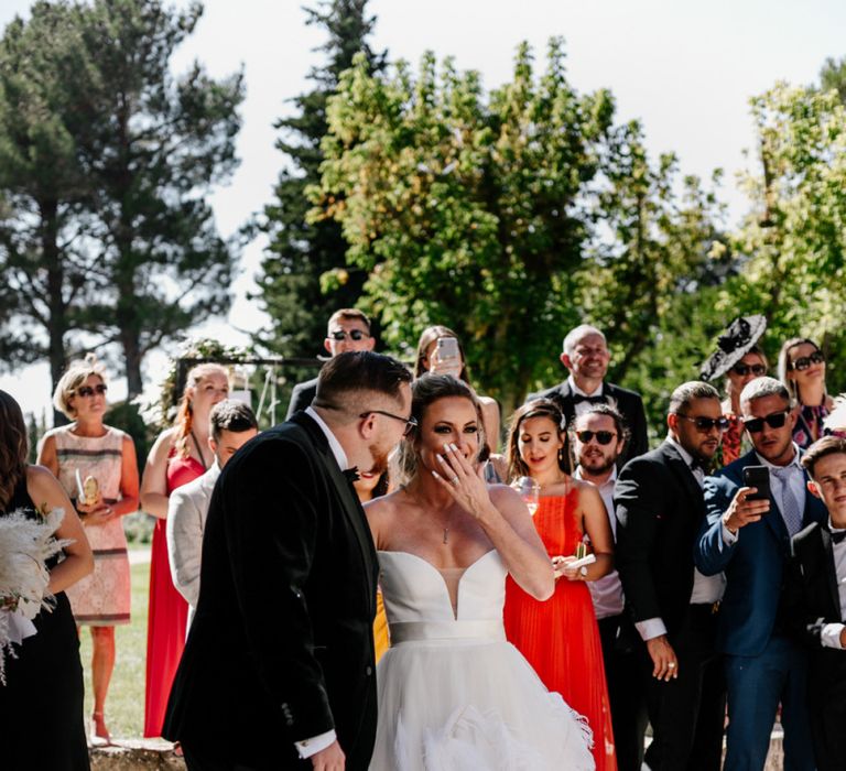 Surprised Bride in Feather Wedding Dress