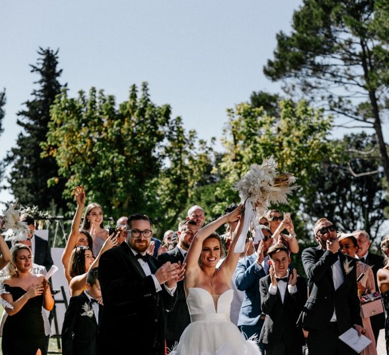 Bride and Groom Applauding the Wedding Choir