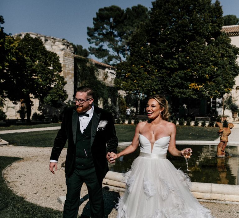 Stylish Bride in Stephanie Allin Feather Wedding Dress and Groom in Black Tie Suit with Bow Tie