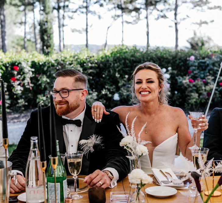 Bride and Groom Laughing During the Wedding Reception