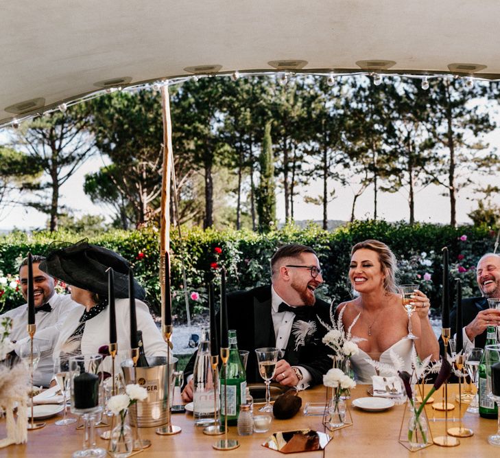 Bride and Groom Laughing During Stretch Tent Wedding Reception