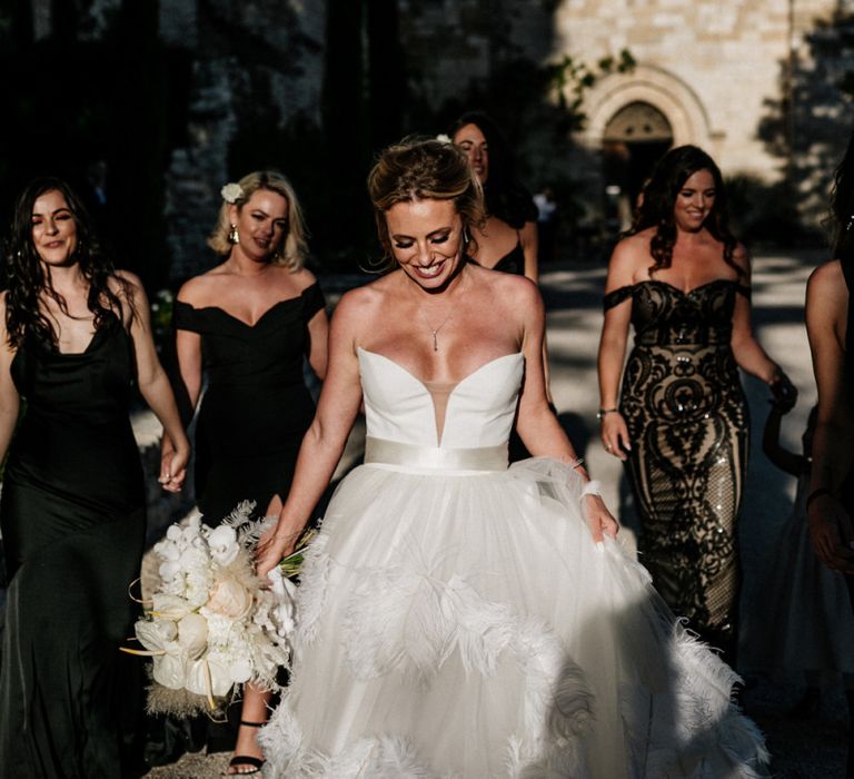 Stunning Bride Walking with Her Bridal Party Through The French Chateau