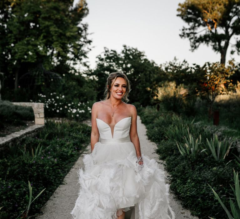 Stylish Bride in Stephanie Allin Wedding Dress with Feather Skirt and Sweetheart Neckline Bodice and Bridal Boots