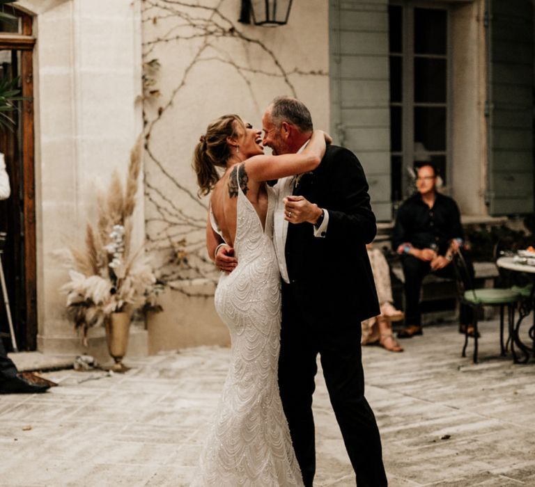 Bride in Embellished Fitted Wedding Dress Dancing with Her Father