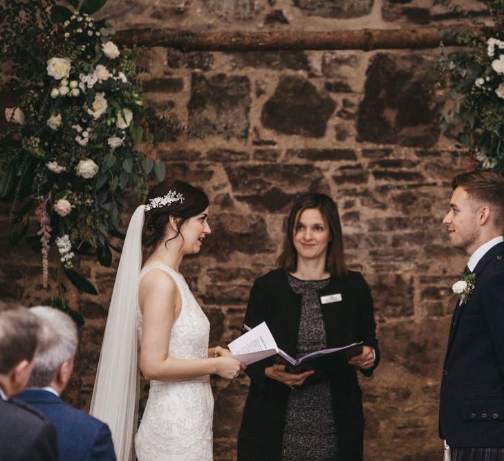 Wedding ceremony with wooden arch