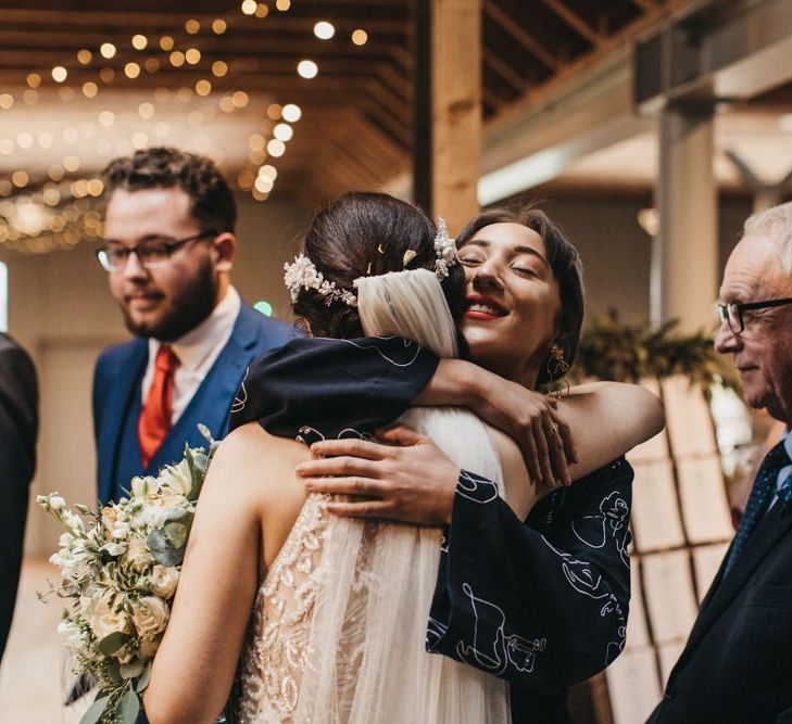 Bride greets wedding guests