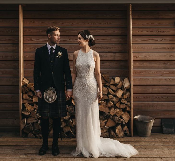 Groom wears traditional Scottish kilt for wedding