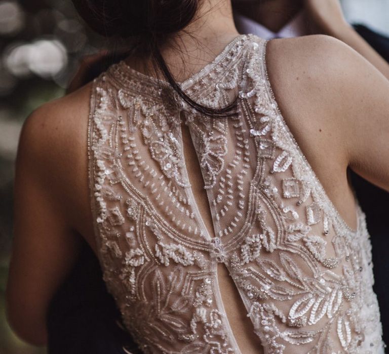 Lace back wedding dress with embellished hairpiece for bride