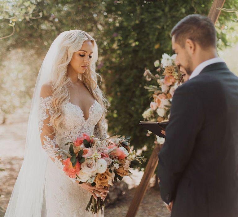 Bride in lace wedding dress at California elopement