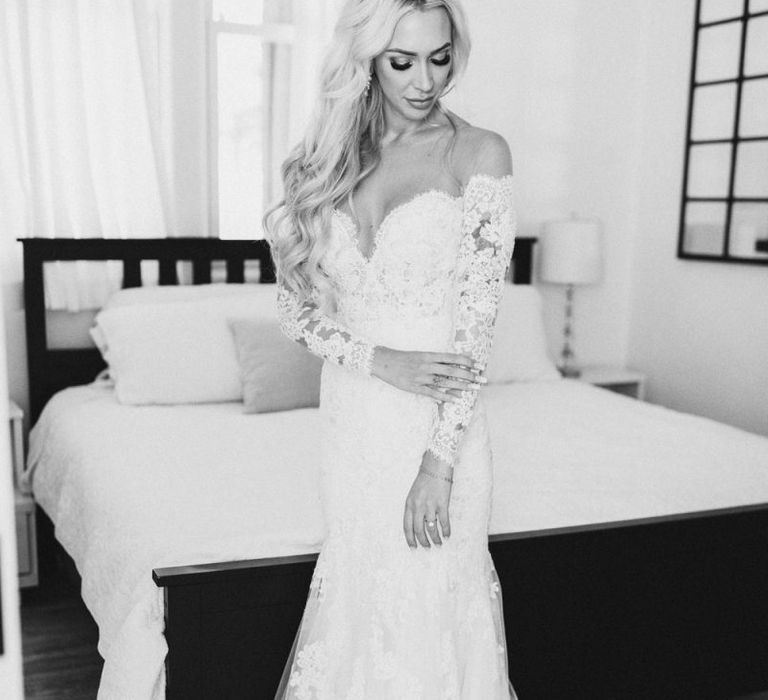 Bride on wedding morning in lace Pronovias wedding dress