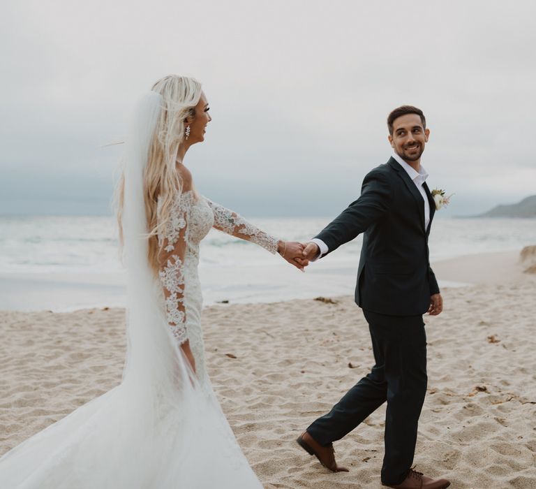 Bride and groom beach portrait by Ariele Chapman Photography