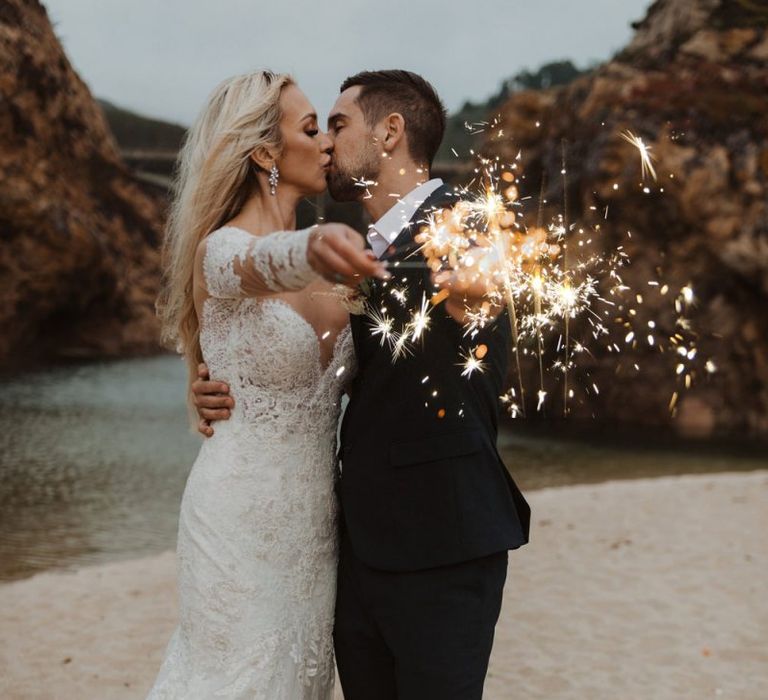 Sparkler moment on the beach at California elopement