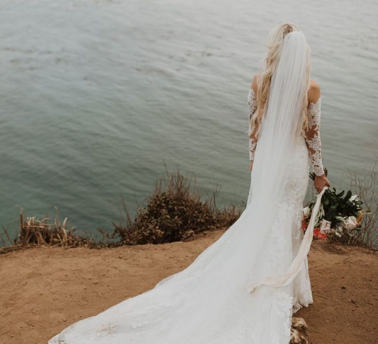 Bride in lace Pronovias wedding dress and wedding veil