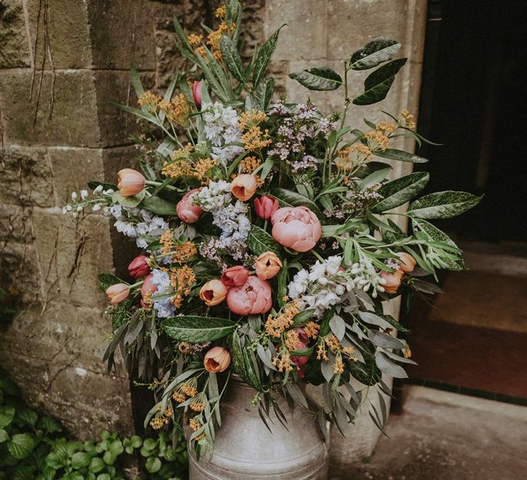 Milk Churn Filled with Colourful Spring Wedding Flowers including Pink Peonies