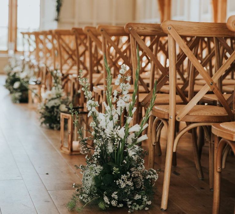 Aisle flower decor at rustic barn wedding at Hyde House