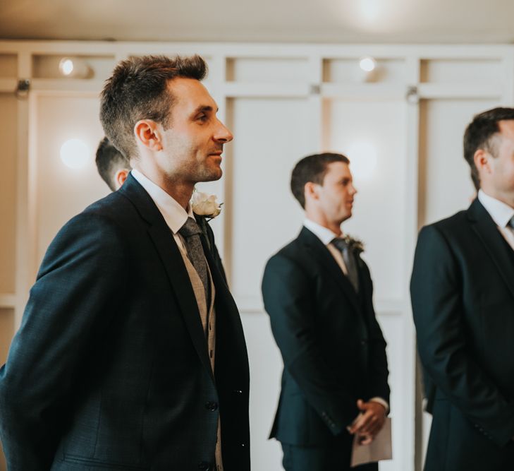 Groom with groomsmen waiting for bride at Hyde House wedding