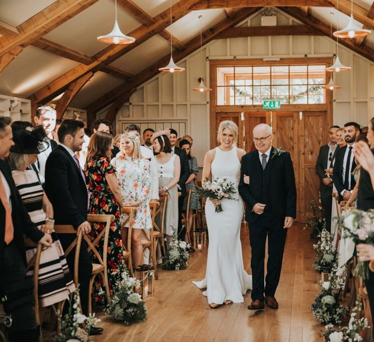 Bride walks down the aisle with Father