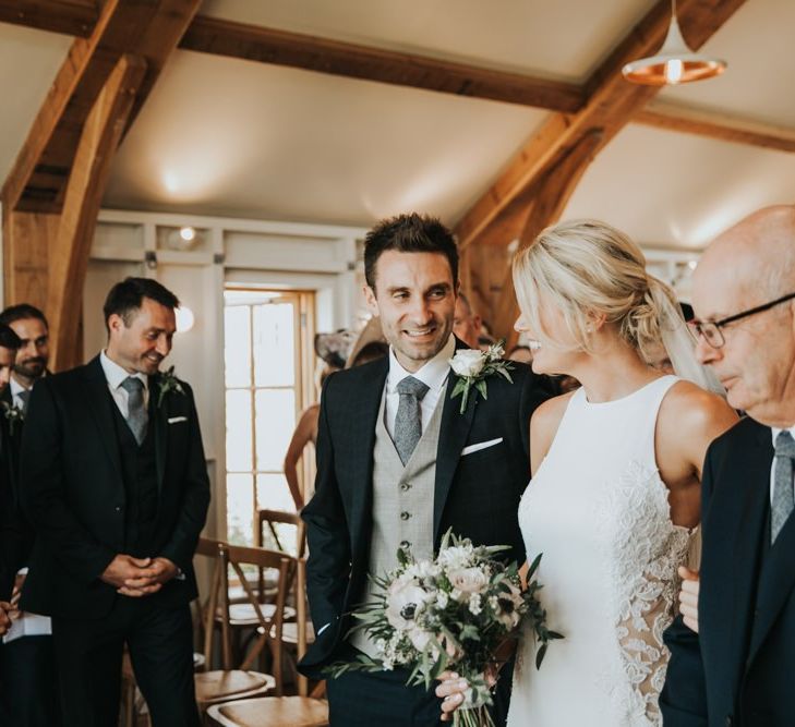 Bride and groom meet at the altar