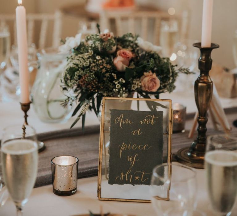 Pink wedding flower and candles for wedding tables