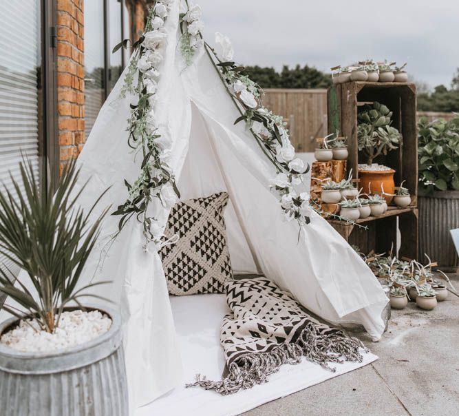 Wooden Crates with Succulent Wedding Favours on and Childrens Tipi