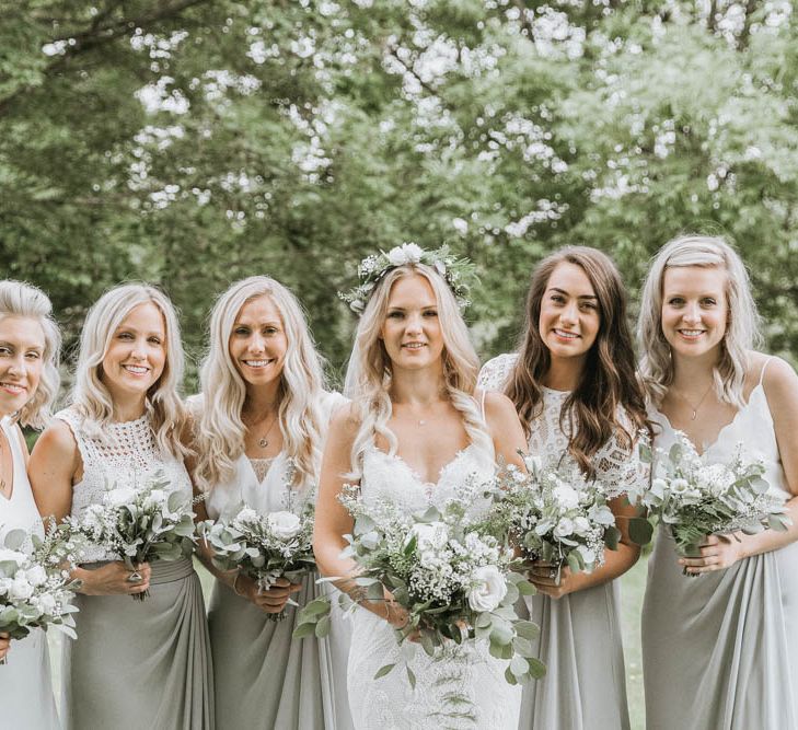 Bridal Party with Bride in Lace Wedding Dres and Bridesmaids  in Different Dresses from The Bridal House o Cornwall