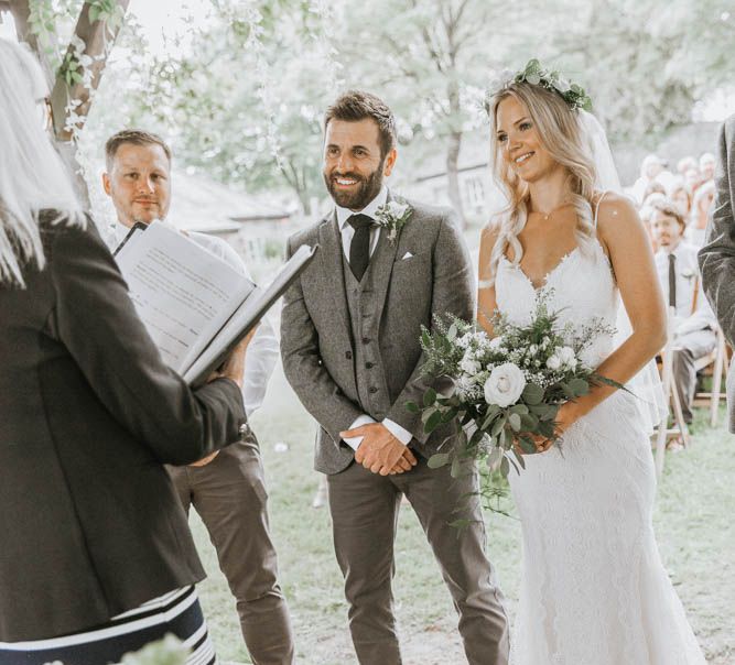 Wedding Ceremony at The Green, Cornwall with Bride in Lace Wedding Dress and Groom in Three-piece Wool Suit