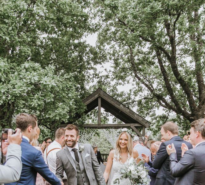 Bride in Lace Wedding Dress and Groom in Wool Suit Just Married!