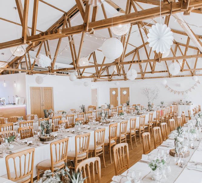 Rustic Barn Reception at The Green, Cornwall with Paper Lanterns, Tree Slice Centrepieces and Burlap Table Runners