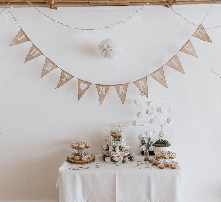 Cake Table with Tree Slice Cake Stand and Burlap Bunting