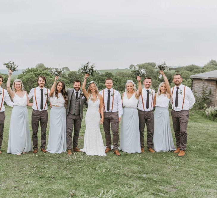 Wedding Party Portrait with Bride in Lace Wedding Dress, Groom in Wool Suit, Bridesmaids in Separates and Groomsmen in Braces