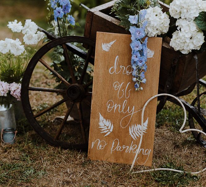 Rustic Planter Pot Filled with White and Blue Flowers