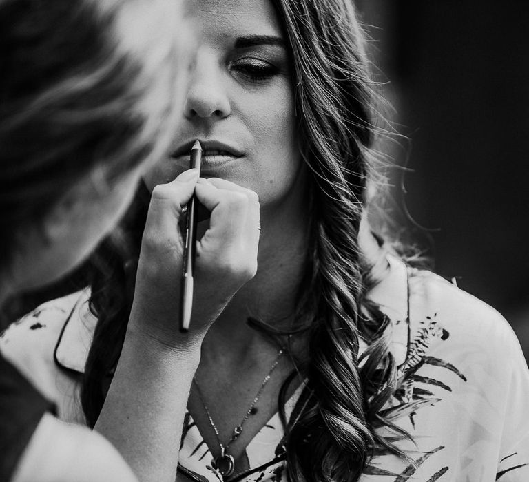 Beautiful Bride Having Her Hair and Makeup Done on The Morning of The Wedding